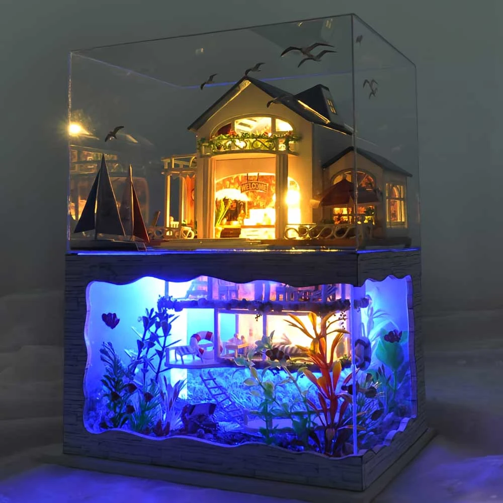 Miniature dollhouse inside an aquarium, combining warm wooden house details with a lit underwater scene for artistic aquarium decoration